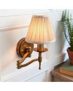 Stanford Swing Arm Beige Shade Wall Light In Antique Brass