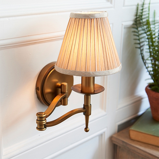 Stanford Swing Arm Beige Shade Wall Light In Antique Brass